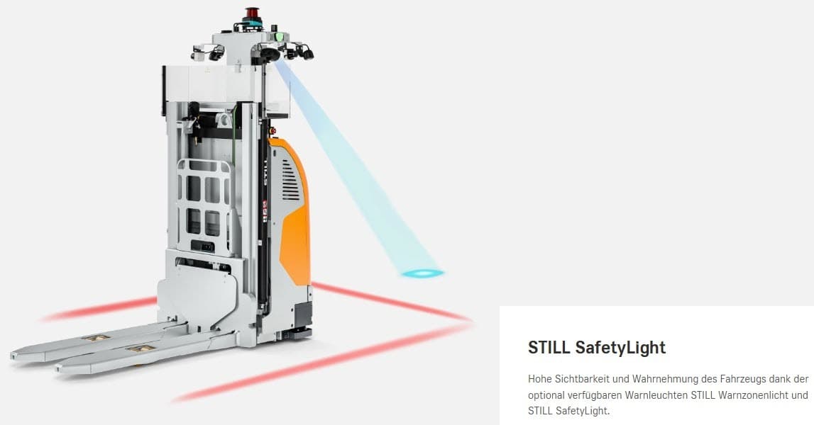 In einem Lagerhaus projiziert ein Robotergabelstapler mit Hilfe von Sicherheitslichtern rote und blaue Bodenzonen und erhöht so die Sichtbarkeit für rationelle Logistikabläufe.
